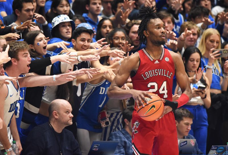 Feb 20, 2023; Durham, North Carolina, USA; Duke Blue Devils fans taunt Louisville Cardinals forward Jae'Lyn Withers (24) as he tries to inbound the ball during the second half at Cameron Indoor Stadium. The Blue Devils won 79-62. Mandatory Credit: Rob Kinnan-USA TODAY Sports