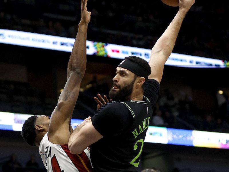 NEW ORLEANS, LOUISIANA - FEBRUARY 23: Larry Nance Jr. #22 of the New Orleans Pelicans dunks the ball over Haywood Highsmith #24 of the Miami Heat during the first quarter of an NBA game at Smoothie King Center on February 23, 2024 in New Orleans, Louisiana. NOTE TO USER: User expressly acknowledges and agrees that, by downloading and or using this photograph, User is consenting to the terms and conditions of the Getty Images License Agreement. (Photo by Sean Gardner/Getty Images)