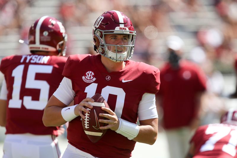 Oct 3, 2020; Tuscaloosa, Alabama, USA; Alabama quarterback Mac Jones (10) warms up before the game with Texas A&M at Bryant-Denny Stadium. Mandatory Credit: Gary Cosby Jr/The Tuscaloosa News via USA TODAY Sports