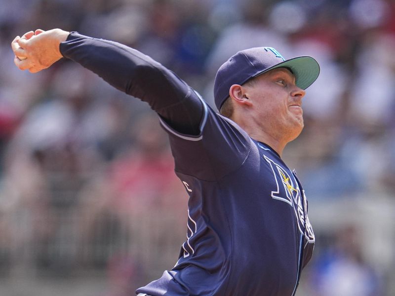 Jun 16, 2024; Cumberland, Georgia, USA; Tampa Bay Rays relief pitcher Pete Fairbanks (29) pitches against the Atlanta Braves during the ninth inning at Truist Park. Mandatory Credit: Dale Zanine-USA TODAY Sports