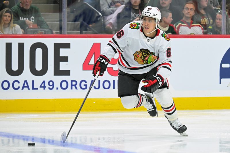 Sep 28, 2025; Saint Paul, Minnesota, USA;  Chicago Blackhawks forward Teuvo Teravainen (86) skates with the puck against the Minnesota Wild during the third period at Xcel Energy Center. Mandatory Credit: Nick Wosika-Imagn Images
