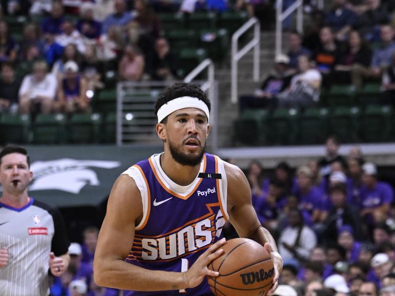 EAST LANSING, MI - OCTOBER 8: Devin Booker #1 of the Phoenix Suns passes the ball during the game against the Detroit Pistons during a NBA Preseason game on October 8, 2024 at the Breslin Center in East Lansing, Michigan. NOTE TO USER: User expressly acknowledges and agrees that, by downloading and/or using this photograph, User is consenting to the terms and conditions of the Getty Images License Agreement. Mandatory Copyright Notice: Copyright 2024 NBAE (Photo by Chris Schwegler/NBAE via Getty Images)