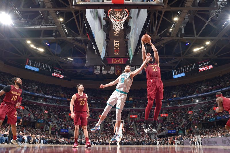 CLEVELAND, OH - MARCH 25: Jarrett Allen #31 of the Cleveland Cavaliers grabs a rebound during the game against the Charlotte Hornets on March 25, 2024 at Rocket Mortgage FieldHouse in Cleveland, Ohio. NOTE TO USER: User expressly acknowledges and agrees that, by downloading and/or using this Photograph, user is consenting to the terms and conditions of the Getty Images License Agreement. Mandatory Copyright Notice: Copyright 2024 NBAE (Photo by David Liam Kyle/NBAE via Getty Images)