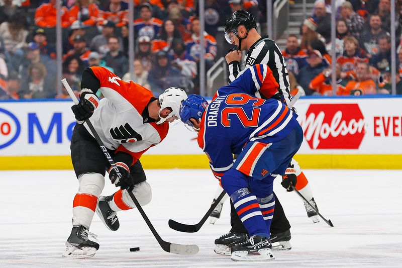 Jan 2, 2024; Edmonton, Alberta, CAN; Edmonton Oilers forward Leon Draisaitl (29) and Philadelphia Flyers forward Sean Couturier (14) face-off during the second period at Rogers Place. Mandatory Credit: Perry Nelson-USA TODAY Sports