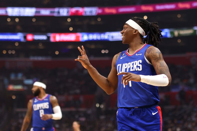 LOS ANGELES, CALIFORNIA - JANUARY 02: Terance Mann #14 of the Los Angeles Clippers reacts to a call during the first quarter against the Miami Heat at Crypto.com Arena on January 02, 2023 in Los Angeles, California. NOTE TO USER: User expressly acknowledges and agrees that, by downloading and or using this photograph, User is consenting to the terms and conditions of the Getty Images License Agreement. (Photo by Katelyn Mulcahy/Getty Images)