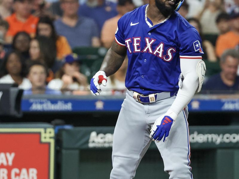 Jul 12, 2024; Houston, Texas, USA;  Texas Rangers right fielder Adolis Garcia (53) reacts after getting ihit by a pitch against the Houston Astros in the fourth inning at Minute Maid Park. Mandatory Credit: Thomas Shea-USA TODAY Sports