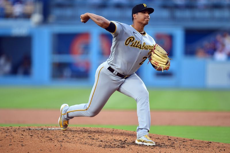 Jul 6, 2023; Los Angeles, California, USA; Pittsburgh Pirates starting pitcher Johan Oviedo (24) throws against the Los Angeles Dodgers during the second inning at Dodger Stadium. Mandatory Credit: Gary A. Vasquez-USA TODAY Sports