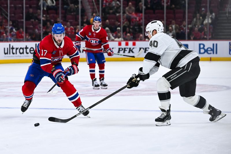 Nov 11, 2025; Montreal, Quebec, CAN; Los Angeles Kings right wing Joel Armia (40) defends the puck agains tMontreal Canadiens right wing Josh Anderson (17) during the third period at Bell Centre. Mandatory Credit: David Kirouac-Imagn Images