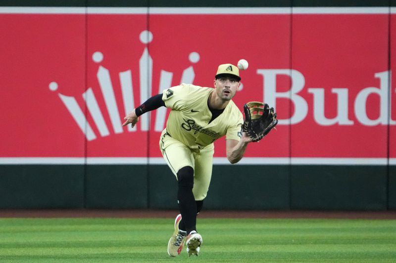 Aug 13, 2024; Phoenix, Arizona, USA; Arizona Diamondbacks outfielder Randal Grichuk (15) catches a line drive during the third inning against the Colorado Rockies at Chase Field. Mandatory Credit: Joe Camporeale-USA TODAY Sports