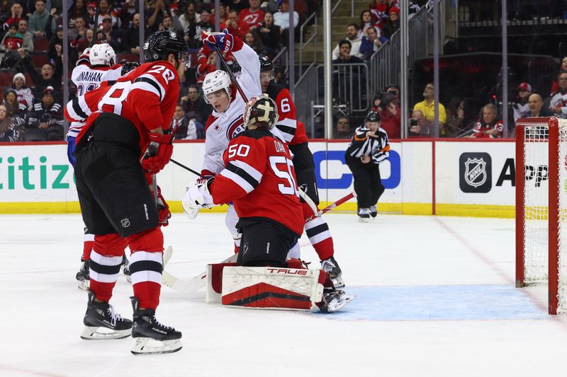 Jan 17, 2024; Newark, New Jersey, USA; Montreal Canadiens right wing Cole Caufield (22) celebrates his goal against the New Jersey Devils during the third period at Prudential Center. Mandatory Credit: Ed Mulholland-USA TODAY Sports