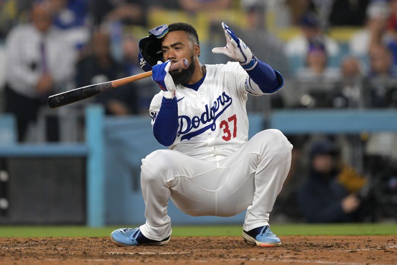 Jun 13, 2024; Los Angeles, California, USA;  Los Angeles Dodgers left fielder Teoscar Hernandez (37) ducks out of the way of a pitch from Texas Rangers relief pitcher Kirby Yates (39) in the ninth inning at Dodger Stadium. Mandatory Credit: Jayne Kamin-Oncea-USA TODAY Sports