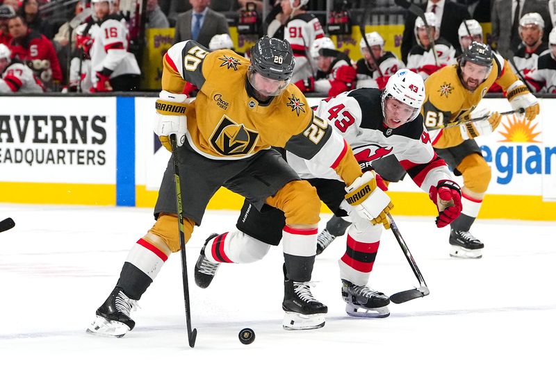 Dec 17, 2025; Las Vegas, Nevada, USA; Vegas Golden Knights left wing Brandon Saad (20) advances the puck ahead of New Jersey Devils defenseman Luke Hughes (43) during the second period at T-Mobile Arena. Mandatory Credit: Stephen R. Sylvanie-Imagn Images
