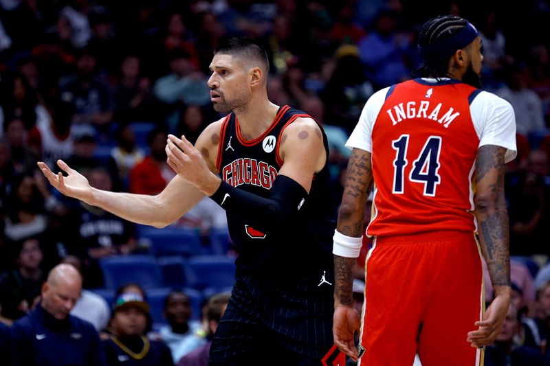 NEW ORLEANS, LOUISIANA - OCTOBER 23: Nikola Vucevic #9 of the Chicago Bulls reacts to a call during the first quarter of an NBA game against the New Orleans Pelicans at Smoothie King Center on October 23, 2024 in New Orleans, Louisiana. NOTE TO USER: User expressly acknowledges and agrees that, by downloading and or using this photograph, User is consenting to the terms and conditions of the Getty Images License Agreement. (Photo by Sean Gardner/Getty Images)