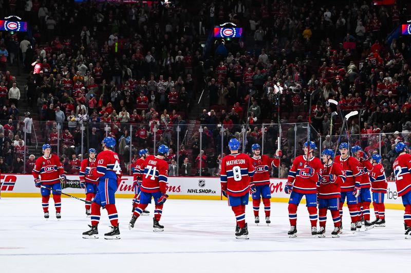 Oct 12, 2024; Montreal, Quebec, CAN; Montreal Canadiens players gather at center ice to salute the crowd after a victory over the Ottawa Senators at Bell Centre. Mandatory Credit: David Kirouac-Imagn Images