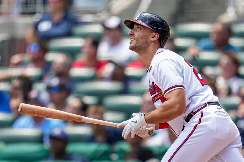 Jun 28, 2023; Cumberland, Georgia, USA; Atlanta Braves first baseman Matt Olson (28) watches the flight of his home run against the Minnesota Twins during the eighth inning at Truist Park. Mandatory Credit: Dale Zanine-USA TODAY Sports