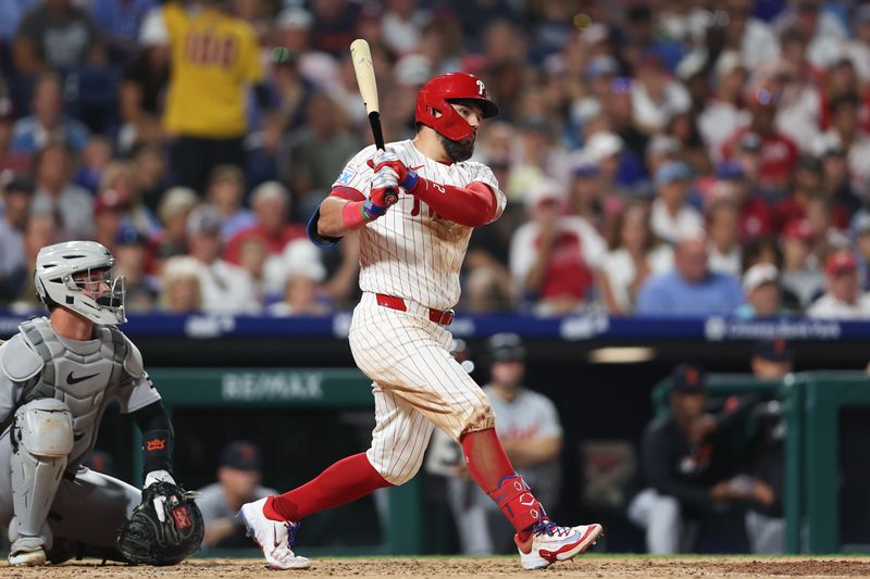 Aug 3, 2025; Philadelphia, Pennsylvania, USA; Philadelphia Phillies outfielder Kyle Schwarber (12) hits a double during the sixth inning against the Detroit Tigers at Citizens Bank Park. Mandatory Credit: Bill Streicher-Imagn Images