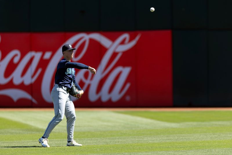 Sep 5, 2024; Oakland, California, USA; Seattle Mariners starting pitcher Bryan Woo (22) plays long toss before facing the Oakland Athletics at Oakland-Alameda County Coliseum. Mandatory Credit: D. Ross Cameron-Imagn Images