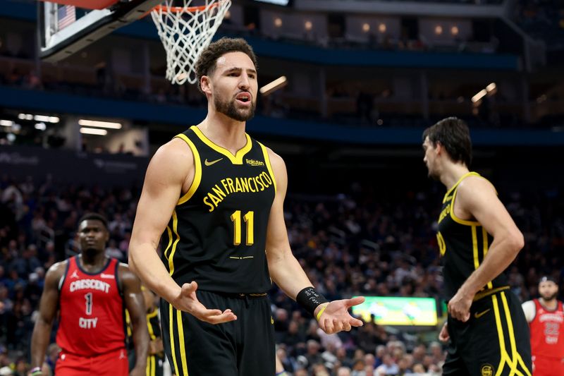 SAN FRANCISCO, CALIFORNIA - JANUARY 10: Klay Thompson #11 of the Golden State Warriors reacts to being called for a foul against the New Orleans Pelicans in the first half at Chase Center on January 10, 2024 in San Francisco, California. NOTE TO USER: User expressly acknowledges and agrees that, by downloading and or using this photograph, User is consenting to the terms and conditions of the Getty Images License Agreement.  (Photo by Ezra Shaw/Getty Images)