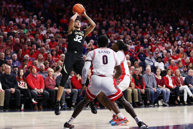 Feb 18, 2023; Tucson, Arizona, USA; Colorado Buffaloes guard Nique Clifford (32) shots a basket against Arizona Wildcats guard Courtney Ramey (0) and guard Cedric Henderson Jr. (45) during the first half at McKale Center. Mandatory Credit: Zachary BonDurant-USA TODAY Sports