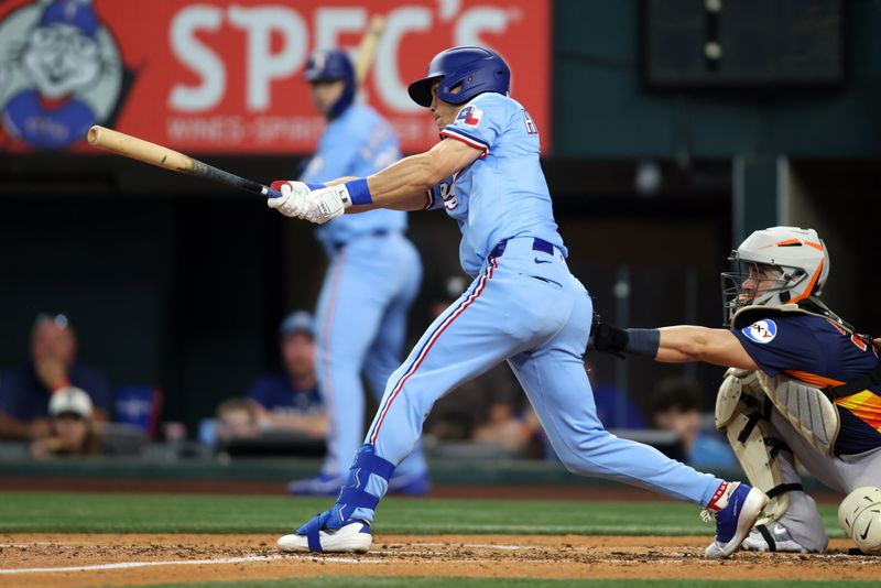 May 18, 2025; Arlington, Texas, USA; Texas Rangers outfielder Sam Haggerty (0) singles during the fourth inning against the Houston Astros at Globe Life Field. Mandatory Credit: Tim Heitman-Imagn Images