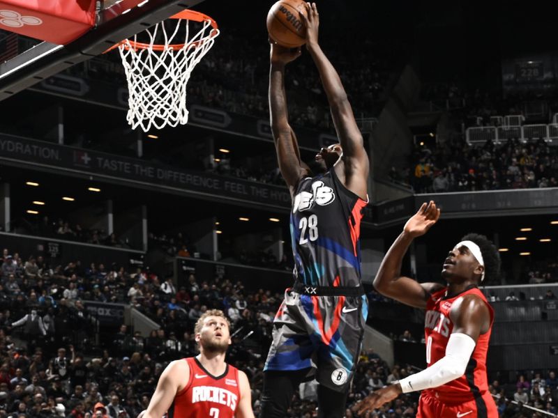 BROOKLYN, NY - JANUARY 27: Dorian Finney-Smith #28 of the Brooklyn Nets dunks the ball during the game against the Houston Rockets on January 27, 2024 at Barclays Center in Brooklyn, New York. NOTE TO USER: User expressly acknowledges and agrees that, by downloading and or using this Photograph, user is consenting to the terms and conditions of the Getty Images License Agreement. Mandatory Copyright Notice: Copyright 2024 NBAE (Photo by David Dow/NBAE via Getty Images)