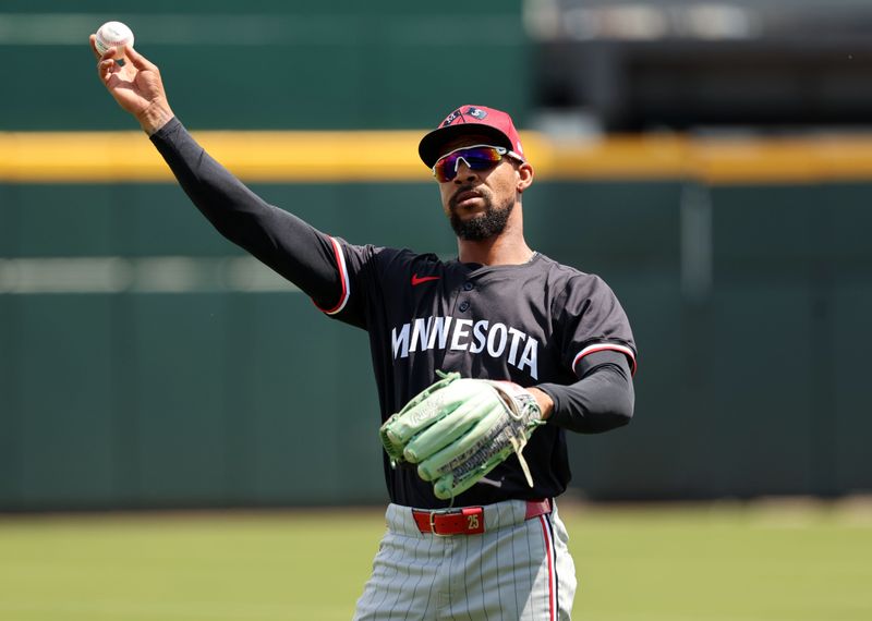 wMar 25, 2024; North Port, Florida, USA; Minnesota Twins center fielder Byron Buxton (25) warms up before the game against the Atlanta Braves at CoolToday Park. Mandatory Credit: Kim Klement Neitzel-USA TODAY Sports