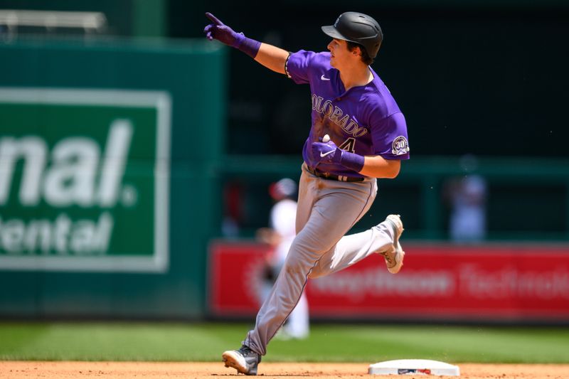 Jul 26, 2023; Washington, District of Columbia, USA; Colorado Rockies first baseman Michael Toglia (4) rounds the bases after hitting a home run during the sixth inning against the Washington Nationals at Nationals Park. Mandatory Credit: Reggie Hildred-USA TODAY Sports