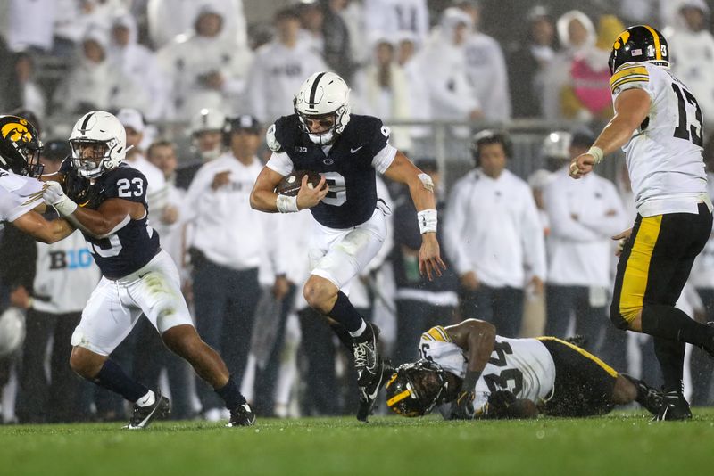 Sep 23, 2023; University Park, Pennsylvania, USA; Penn State Nittany Lions quarterback Beau Pribula (9) runs with the ball after breaking a tackle during the fourth quarter against the Iowa Hawkeyes at Beaver Stadium. Penn State defeated Iowa 31-0. Mandatory Credit: Matthew O'Haren-USA TODAY Sports