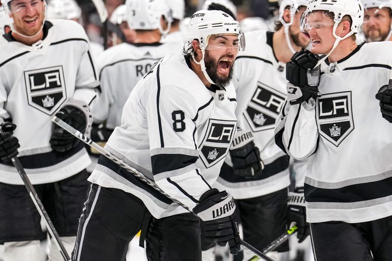 Oct 15, 2022; Saint Paul, Minnesota, USA; Los Angeles Kings defenseman Drew Doughty (8) celebrates following the game against the Minnesota Wild at Xcel Energy Center. Mandatory Credit: Brace Hemmelgarn-USA TODAY Sports