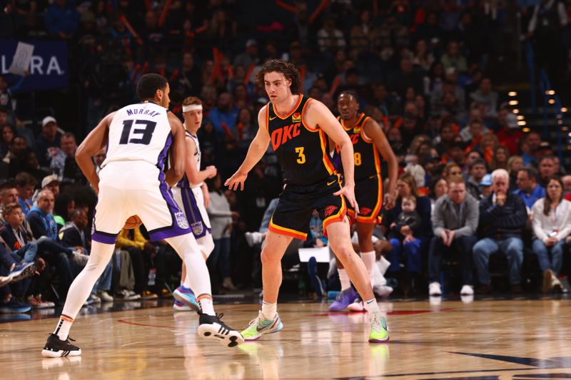 OKLAHOMA CITY, OK - FEBRUARY 11: Josh Giddey #3 of the Oklahoma City Thunder plays defense against the Sacramento Kings on February 11, 2024 at Paycom Arena in Oklahoma City, Oklahoma. NOTE TO USER: User expressly acknowledges and agrees that, by downloading and or using this photograph, User is consenting to the terms and conditions of the Getty Images License Agreement. Mandatory Copyright Notice: Copyright 2024 NBAE (Photo by Zach Beeker/NBAE via Getty Images)