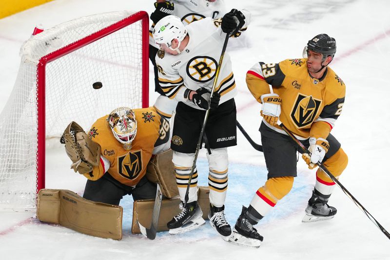 Jan 11, 2024; Las Vegas, Nevada, USA; Vegas Golden Knights goaltender Logan Thompson (36) makes a save behind Boston Bruins center Morgan Geekie (39) and Vegas Golden Knights defenseman Alec Martinez (23) during the third period at T-Mobile Arena. Mandatory Credit: Stephen R. Sylvanie-USA TODAY Sports