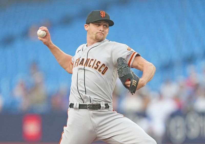 Jun 29, 2023; Toronto, Ontario, CAN; San Francisco Giants starting pitcher Keaton Winn (67) throws a pitch against the Toronto Blue Jays during the first inning at Rogers Centre. Mandatory Credit: Nick Turchiaro-USA TODAY Sports