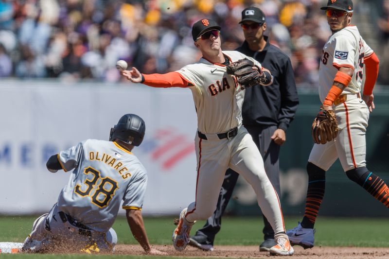 Apr 28, 2024; San Francisco, California, USA;  San Francisco Giants shortstop Tyler Fitzgerald (49) throws to first base after tagging Pittsburgh Pirates designated hitter Edward Olivares (38) for a double play during the second inning at Oracle Park. Mandatory Credit: John Hefti-USA TODAY Sports