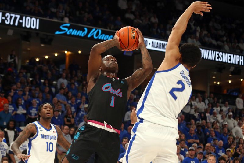 Feb 25, 2024; Memphis, Tennessee, USA; Florida Atlantic Owls guard Johnell Davis (1) shoots as Memphis Tigers forward Nicholas Jourdain (2) defends during the second half at FedExForum. Mandatory Credit: Petre Thomas-USA TODAY Sports