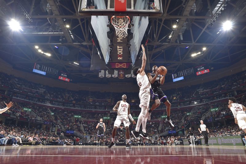 CLEVELAND, OH - FEBRUARY 5: De'Aaron Fox #5 of the Sacramento Kings drives to the basket during the game against the Cleveland Cavaliers on February 5, 2024 at Rocket Mortgage FieldHouse in Cleveland, Ohio. NOTE TO USER: User expressly acknowledges and agrees that, by downloading and/or using this Photograph, user is consenting to the terms and conditions of the Getty Images License Agreement. Mandatory Copyright Notice: Copyright 2024 NBAE (Photo by David Liam Kyle/NBAE via Getty Images)