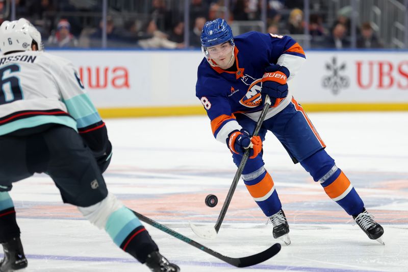 Dec 5, 2024; Elmont, New York, USA; New York Islanders defenseman Noah Dobson (8) plays the puck past Seattle Kraken defenseman Adam Larsson (6) during the second period at UBS Arena. Mandatory Credit: Brad Penner-Imagn Images