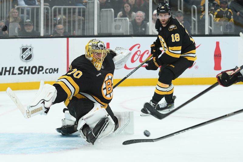 Oct 9, 2025; Boston, Massachusetts, USA; Boston Bruins goaltender Joonas Korpisalo (70) makes a save during overtime against the Chicago Blackhawks at TD Garden. Mandatory Credit: Bob DeChiara-Imagn Images