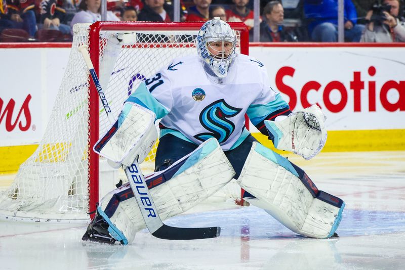 Mar 4, 2024; Calgary, Alberta, CAN; Seattle Kraken goaltender Philipp Grubauer (31) guards his net against the Calgary Flames during the second period at Scotiabank Saddledome. Mandatory Credit: Sergei Belski-USA TODAY Sports