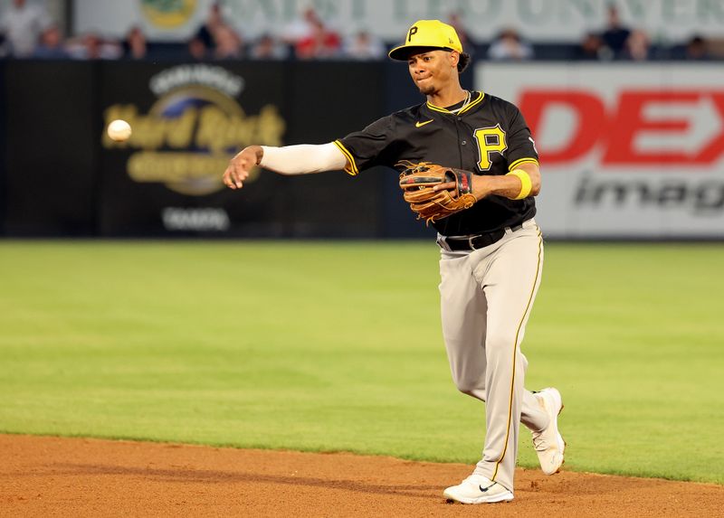 Mar 15, 2024; Tampa, Florida, USA; Pittsburgh Pirates infielder Sergio Alcantara (70) throws the ball to first base for an out during the fourth inning against the New York Yankees at George M. Steinbrenner Field. Mandatory Credit: Kim Klement Neitzel-USA TODAY Sports