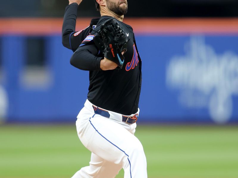 May 30, 2025; New York City, New York, USA; New York Mets starting pitcher David Peterson (23) pitches against the Colorado Rockies during the first inning at Citi Field. Mandatory Credit: Brad Penner-Imagn Images