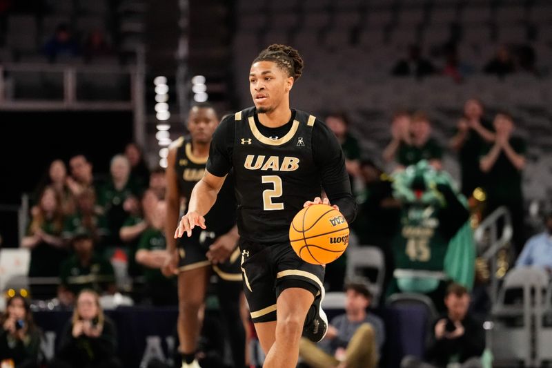 Mar 16, 2024; Fort Worth, TX, USA;  UAB Blazers guard Daniel Ortiz (2) dribbles the ball up court against the South Florida Bulls during the first half at Dickies Arena. Mandatory Credit: Chris Jones-USA TODAY Sports