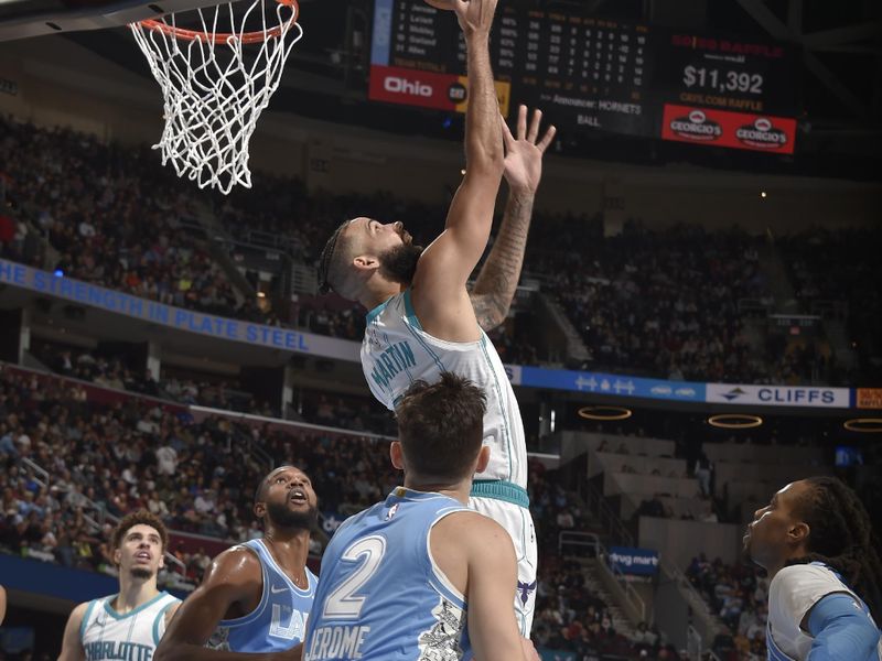 CLEVELAND, OH - NOVEMBER 17: Cody Martin #11 of the Charlotte Hornets shoots the ball during the game against the Cleveland Cavaliers on November 17, 2024 at Rocket Mortgage FieldHouse in Cleveland, Ohio. NOTE TO USER: User expressly acknowledges and agrees that, by downloading and/or using this Photograph, user is consenting to the terms and conditions of the Getty Images License Agreement. Mandatory Copyright Notice: Copyright 2024 NBAE (Photo by David Liam Kyle/NBAE via Getty Images)