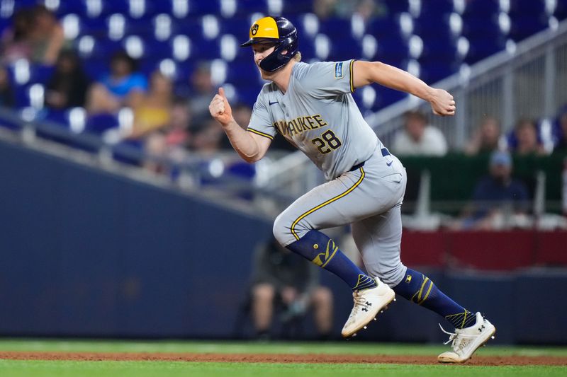 May 22, 2024; Miami, Florida, USA; Milwaukee Brewers outfielder Joey Wiemer (28) runs to second base against the Miami Marlins during the eighth inning at loanDepot Park. Mandatory Credit: Rich Storry-USA TODAY Sports