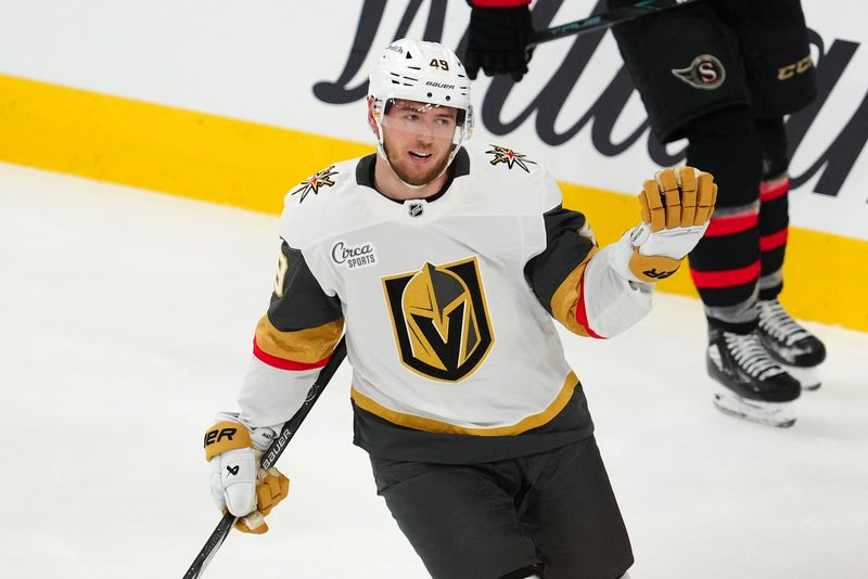 Oct 25, 2024; Las Vegas, Nevada, USA; Vegas Golden Knights center Ivan Barbashev (49) reacts after taking a pass from Vegas Golden Knights center Jack Eichel (9) to score an empty net goal against the Ottawa Senators during the third period at T-Mobile Arena. Mandatory Credit: Stephen R. Sylvanie-Imagn Images