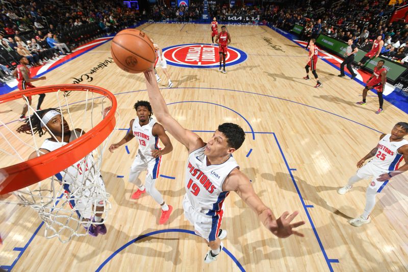 DETROIT, MI - MARCH 17: Simone Fontecchio #19 of the Detroit Pistons grabs the rebound during the game on March 17, 2024 at Little Caesars Arena in Detroit, Michigan. NOTE TO USER: User expressly acknowledges and agrees that, by downloading and/or using this photograph, User is consenting to the terms and conditions of the Getty Images License Agreement. Mandatory Copyright Notice: Copyright 2024 NBAE (Photo by Chris Schwegler/NBAE via Getty Images)