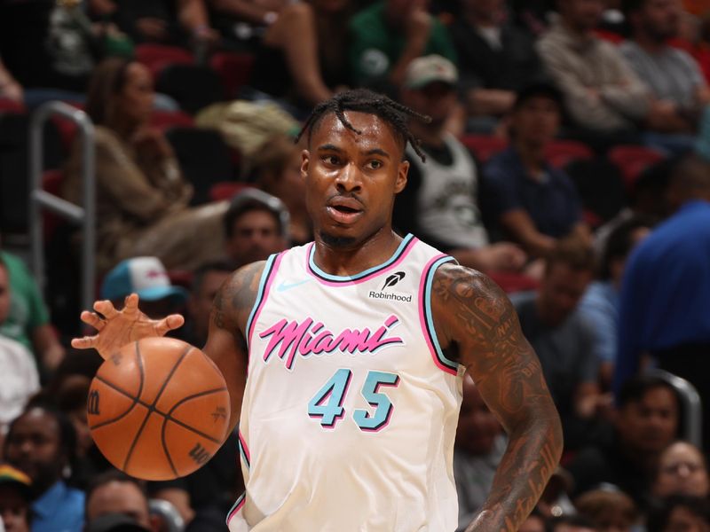 MIAMI, FL - FEBRUARY 10:  Davion Mitchell #45 of the Miami Heat dribbles the ball during the game against the Boston Celtics on February 10, 2025 at Kaseya Center in Miami, Florida. NOTE TO USER: User expressly acknowledges and agrees that, by downloading and or using this Photograph, user is consenting to the terms and conditions of the Getty Images License Agreement. Mandatory Copyright Notice: Copyright 2025 NBAE (Photo by Issac Baldizon/NBAE via Getty Images)