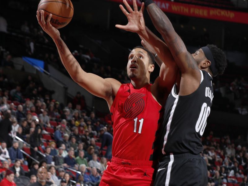 PORTLAND, OR - JANUARY 17: Malcolm Brogdon #11 of the Portland Trail Blazers drives to the basket during the game against the Brooklyn Nets on January 17, 2024 at the Moda Center Arena in Portland, Oregon. NOTE TO USER: User expressly acknowledges and agrees that, by downloading and or using this photograph, user is consenting to the terms and conditions of the Getty Images License Agreement. Mandatory Copyright Notice: Copyright 2024 NBAE (Photo by Cameron Browne/NBAE via Getty Images)