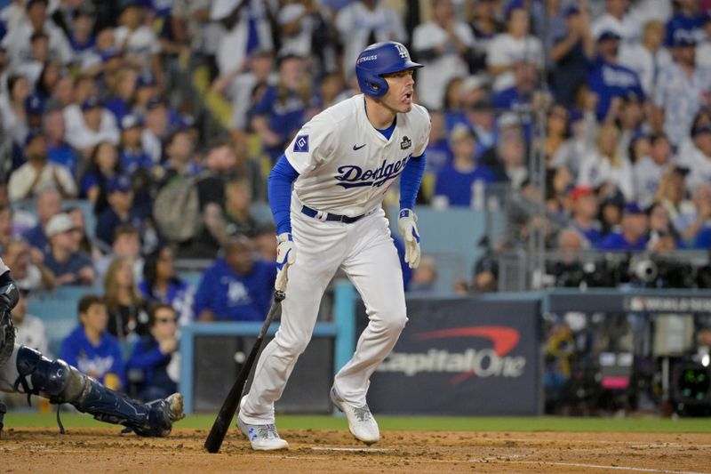 Oct 26, 2024; Los Angeles, California, USA; Los Angeles Dodgers first baseman Freddie Freeman (5) reacts after hitting a solo home run in the third inning against the New York Yankees during game two of the 2024 MLB World Series at Dodger Stadium. Mandatory Credit: Jayne Kamin-Oncea-Imagn Images