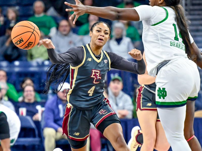 Jan 1, 2023; South Bend, Indiana, USA; Boston College Eagles guard JoJo Lacey (4) passes the ball as Notre Dame Fighting Irish guard KK Bransford (14) defends in the first half at the Purcell Pavilion. Mandatory Credit: Matt Cashore-USA TODAY Sports