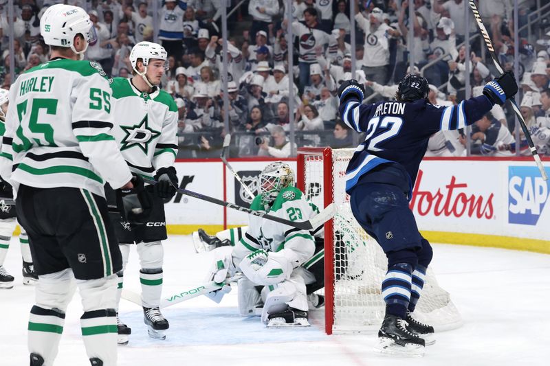 May 9, 2025; Winnipeg, Manitoba, CAN;Winnipeg Jets center Mason Appleton (22) celebrates a goal by Winnipeg Jets center Adam Lowry (17) (not shown) on Dallas Stars goaltender Jake Oettinger (29) in the second period in game two of the second round of the 2025 Stanley Cup Playoffs at Canada Life Centre. Mandatory Credit: James Carey Lauder-Imagn Images